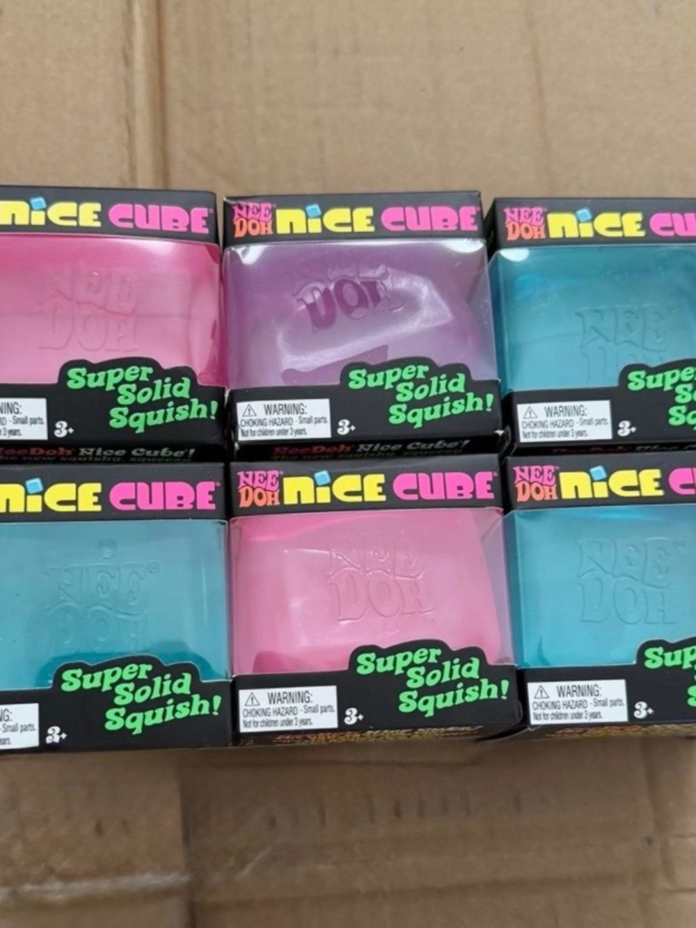 1 Nice Cube Super Solid Squish Stress Toy - Assorted colors.